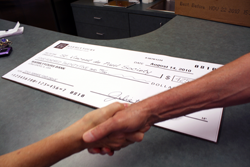 Handing over cheque 